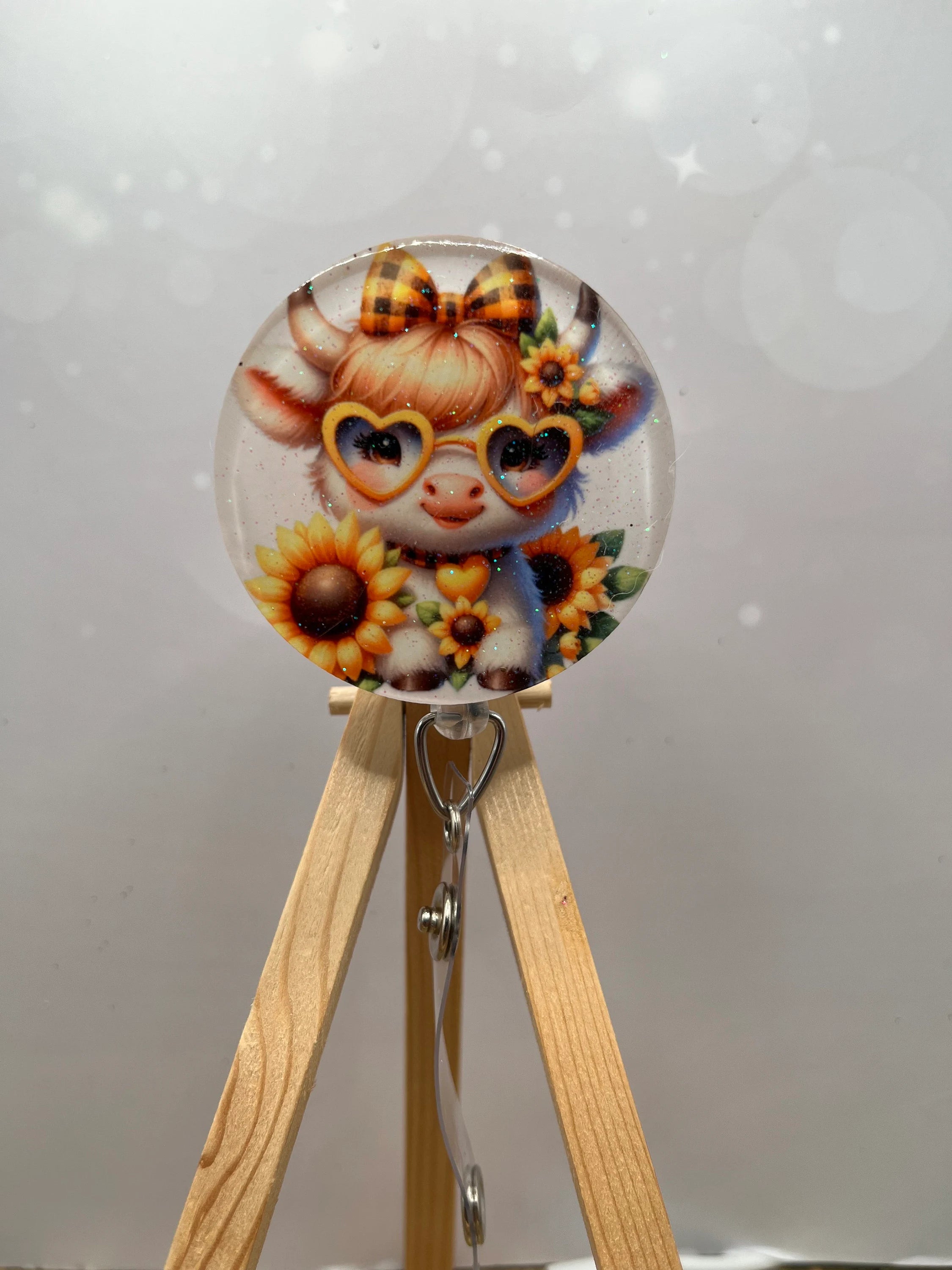 Highland Cow badge pulls. Brighten your shift, one cow at a time. Multiple Images available. Add beads or shimmer glitter options.