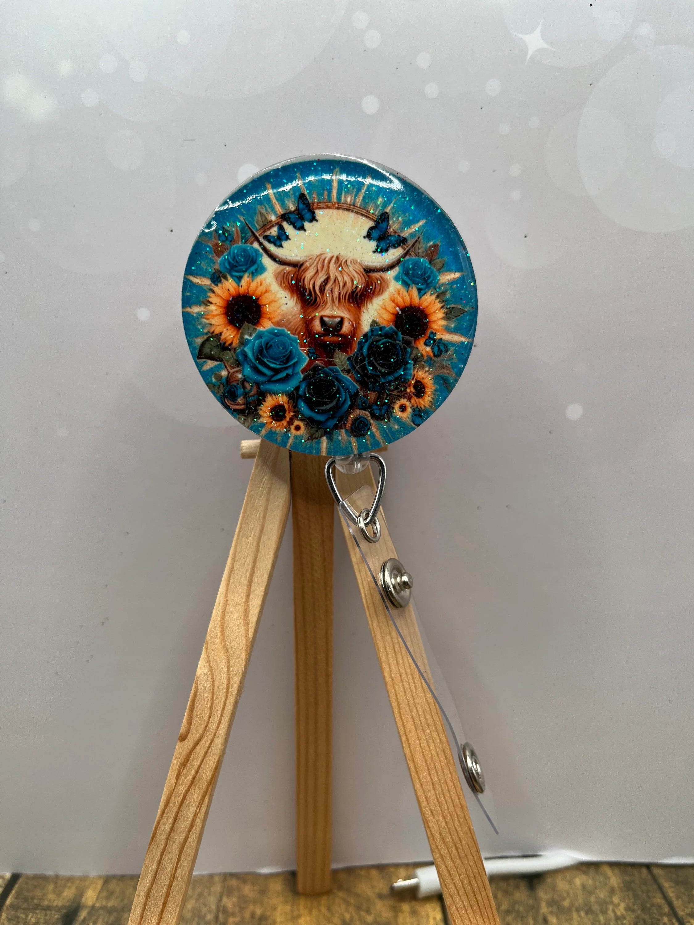 Highland Cow badge pulls. Brighten your shift, one cow at a time. Multiple Images available. Add beads or shimmer glitter options.