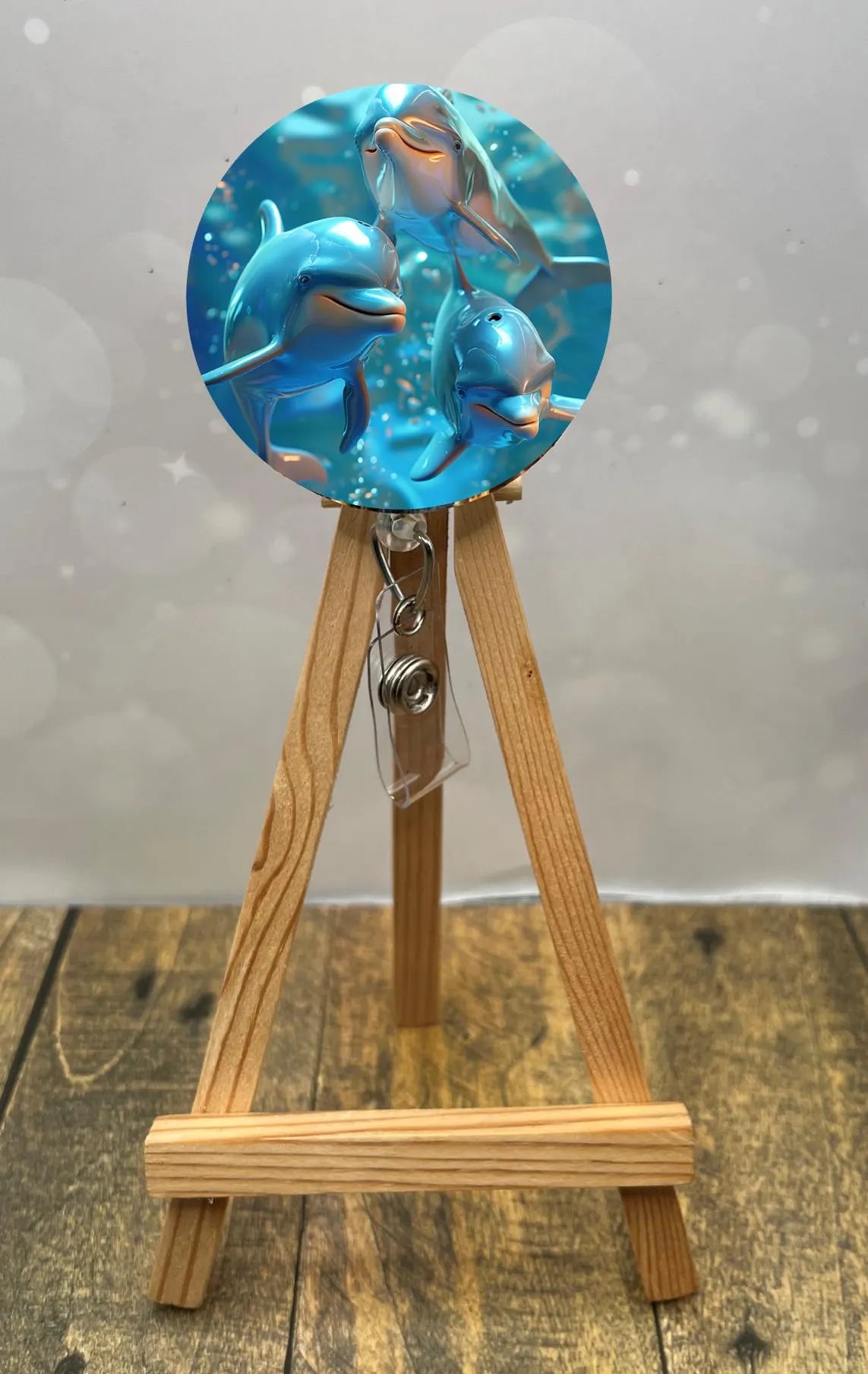 Dolphin badge pulls. Cute, coastal, and ready for every shift. Multiple Images available. Add beads or shimmer glitter options.