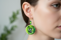 Lucky Elephant St. Patrick's Day Earrings on person with beads